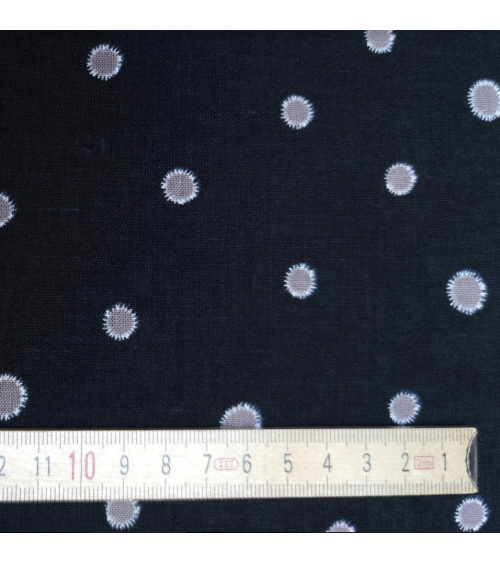 Japanese cotton-linen fabric with irregular polka dots over black background
