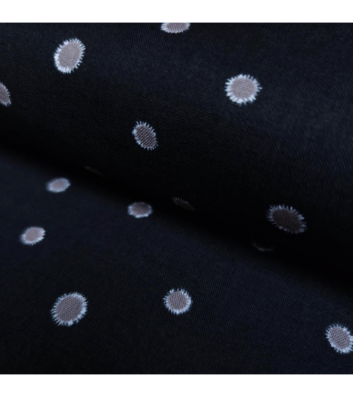 Japanese cotton-linen fabric with irregular polka dots over black background