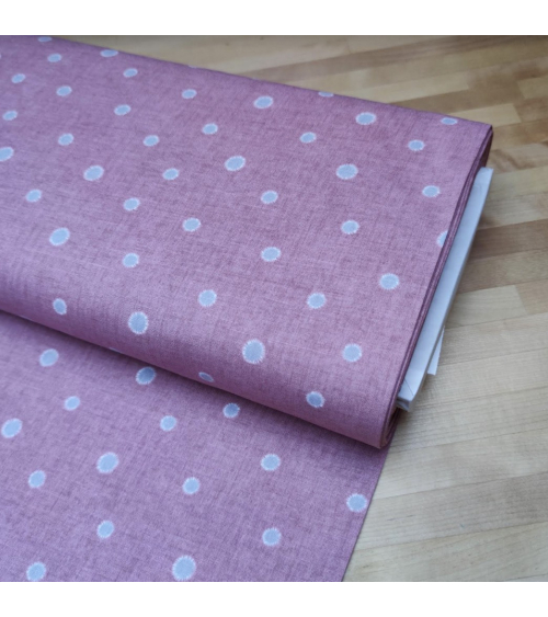 Japanese cotton-linen fabric with irregular polka dots over mauve background