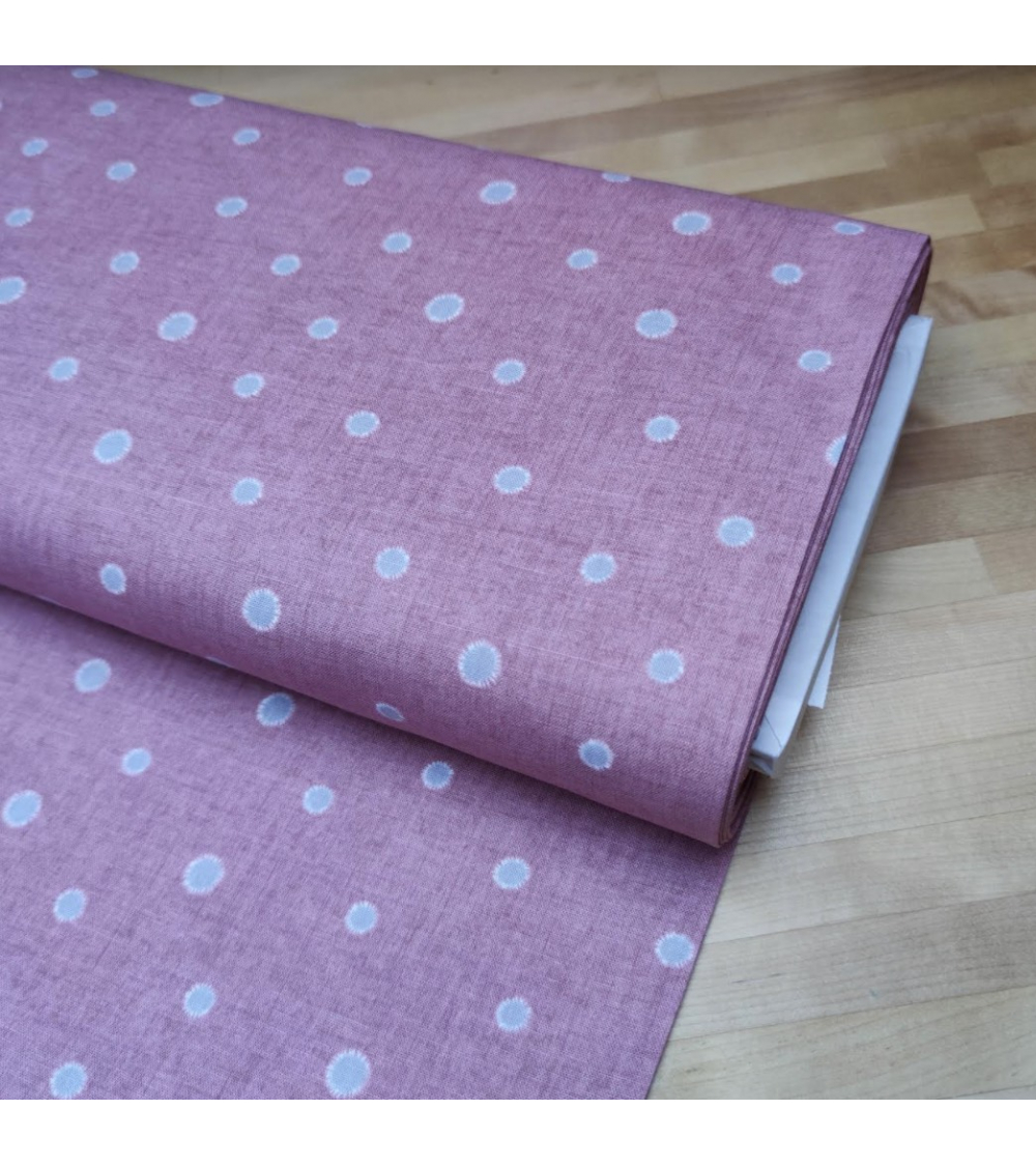 Japanese cotton-linen fabric with irregular polka dots over mauve background