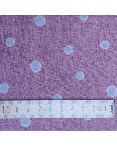 Japanese cotton-linen fabric with irregular polka dots over mauve background