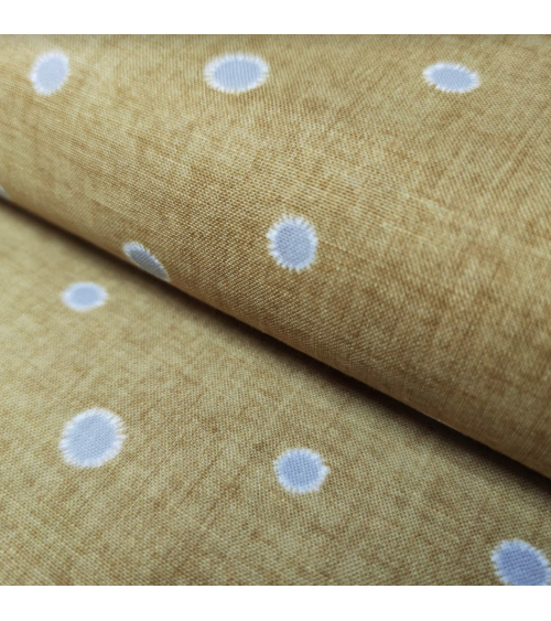 Japanese cotton-linen fabric with irregular polka dots over mustard background