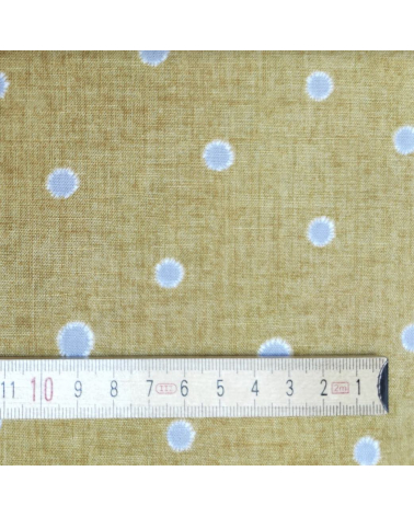 Japanese cotton-linen fabric with irregular polka dots over mustard background