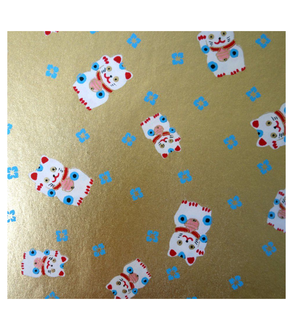 Papel japonés chiyogami maneki neko sobre fondo dorado