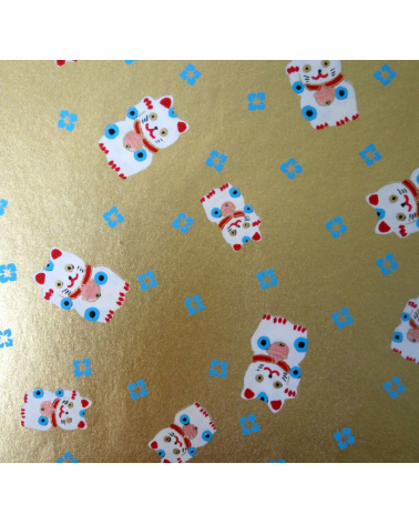 Papel japonés chiyogami maneki neko sobre fondo dorado