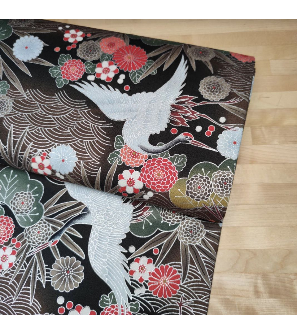 Japanese fabric of cranes in brown and black with silver details.