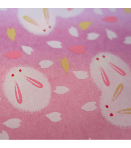 Papel japonés chiyogami tiernos conejitos sobre fondo en rosas 