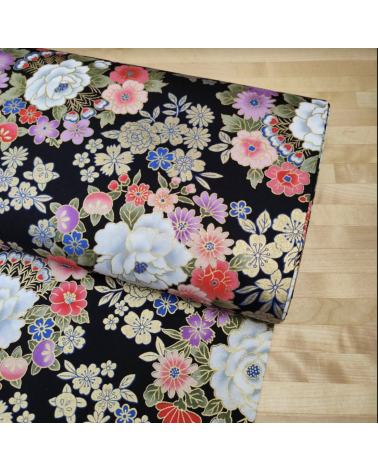 Japanese fabric with multicolor and golden flowers on black.