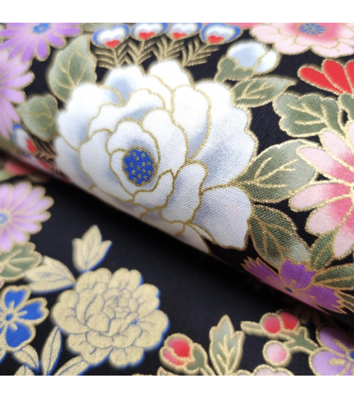 Japanese fabric with multicolor and golden flowers on black.