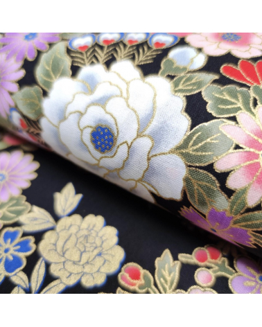 Japanese fabric with multicolor and golden flowers on black.