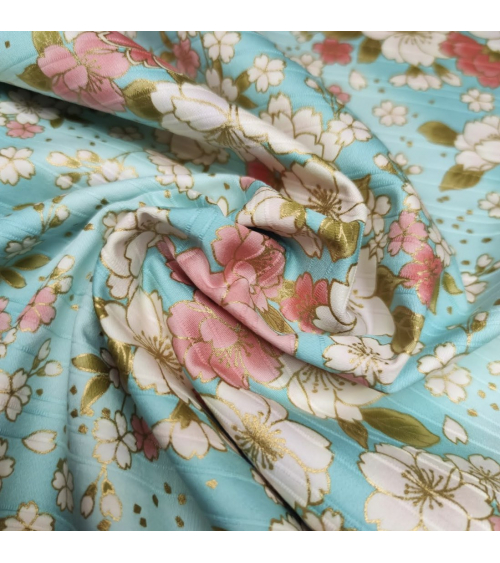 Tela japonesa en Satin de algodón "Hanafubuki" (Lluvia de pétalos) en azul claro.