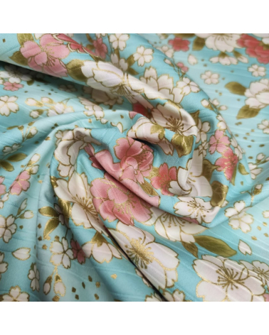 Tela japonesa en Satin de algodón "Hanafubuki" (Lluvia de pétalos) en azul claro.