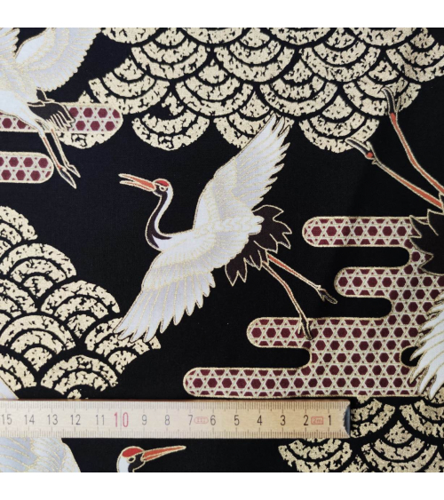 Japanese fabric. Flying Cranes and Clouds over black.