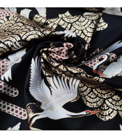 Japanese fabric. Flying Cranes and Clouds over black.