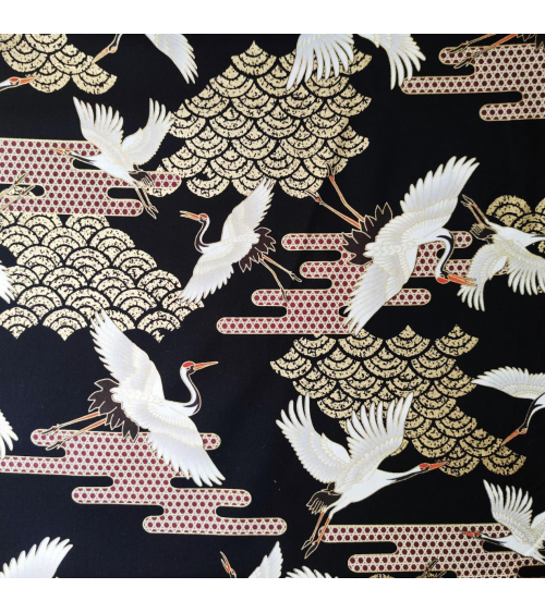 Japanese fabric. Flying Cranes and Clouds over black.