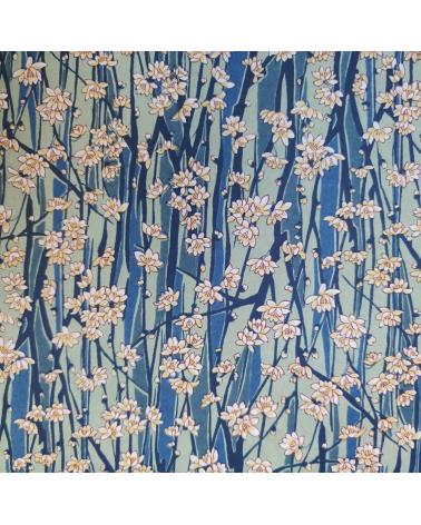 Japanese Chiyogami paper of magnolia flowers over blue and green