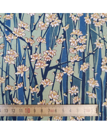 Japanese Chiyogami paper of magnolia flowers over blue and green
