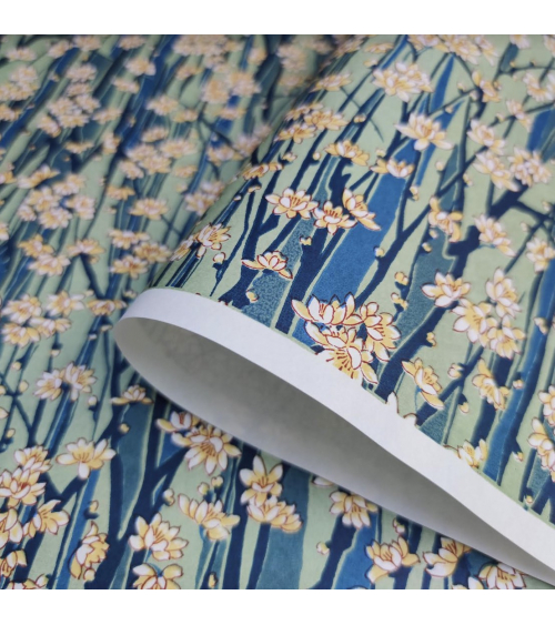 Japanese Chiyogami paper of magnolia flowers over blue and green