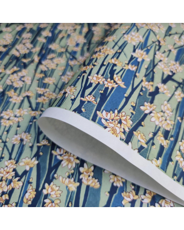 Japanese Chiyogami paper of magnolia flowers over blue and green