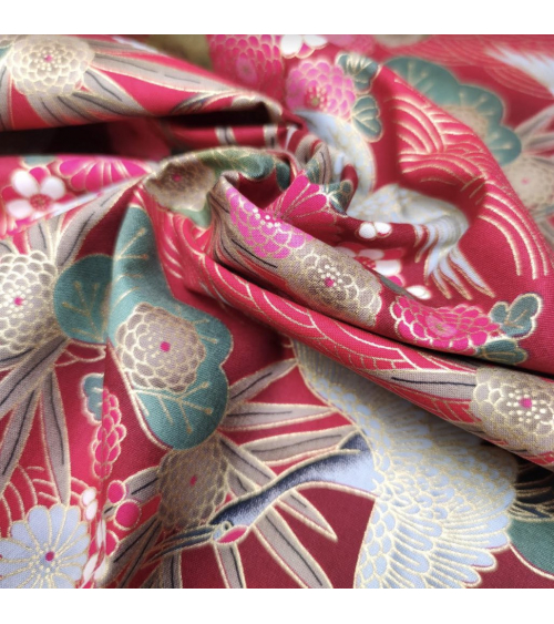 Japanese cotton fabric of cranes in red with golden details.