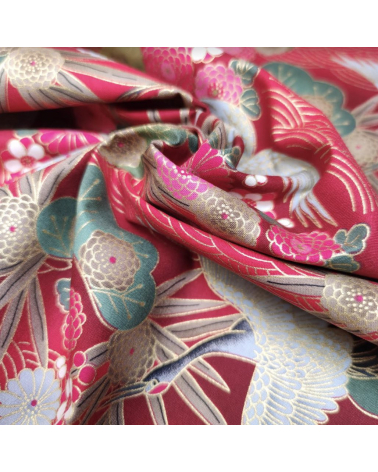Japanese cotton fabric of cranes in red with golden details.