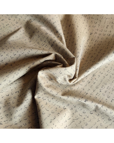 Japanese fabric. Hiragana over sand.