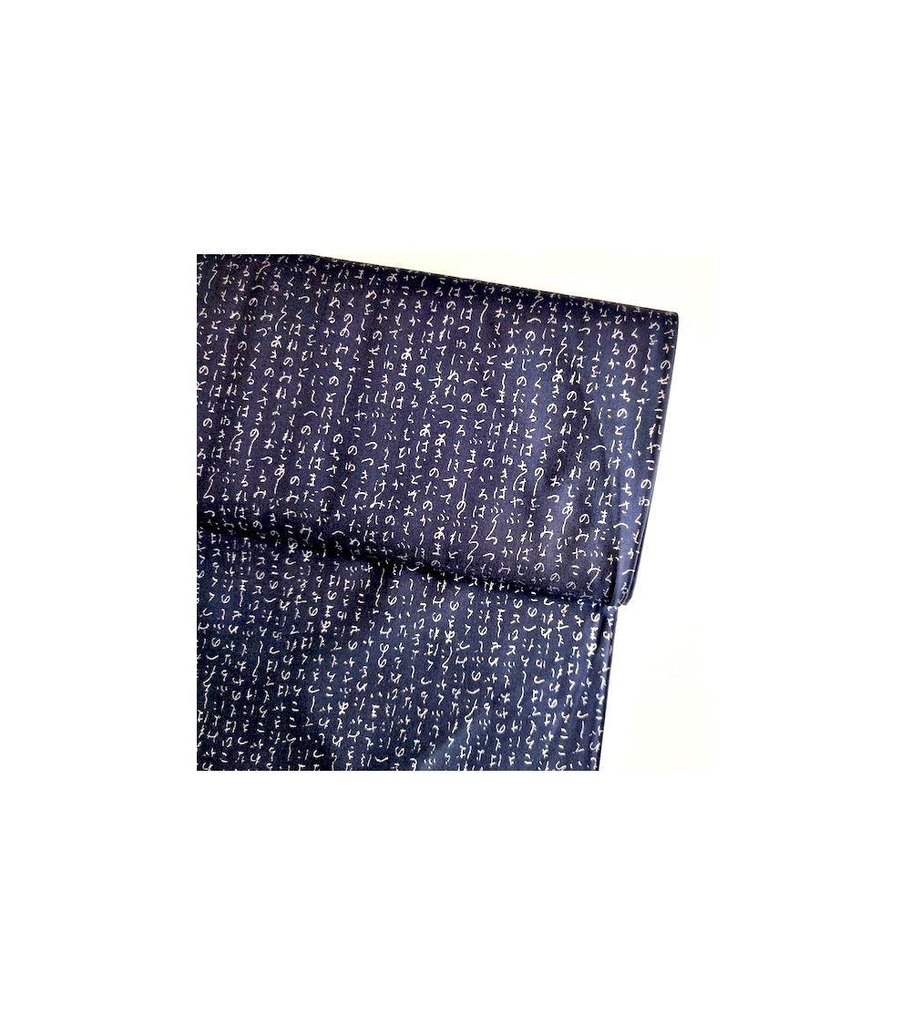 Japanese fabric. Hiragana in silver over navy blue.