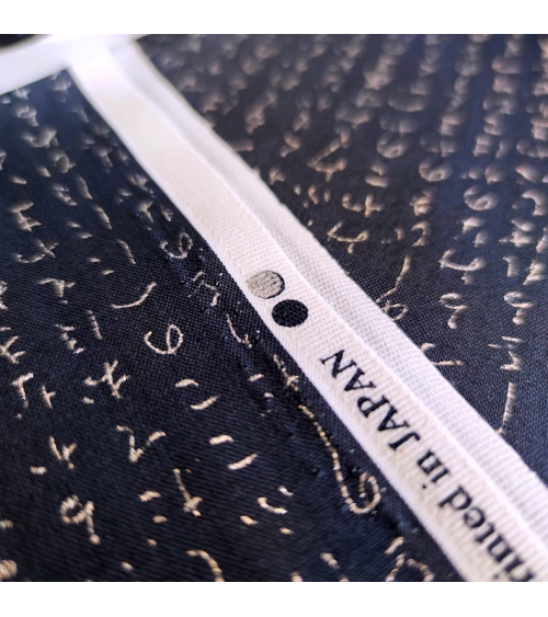 Japanese fabric. Hiragana in silver over navy blue.