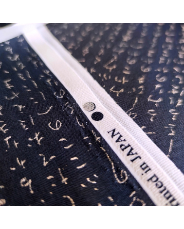 Japanese fabric. Hiragana in silver over navy blue.