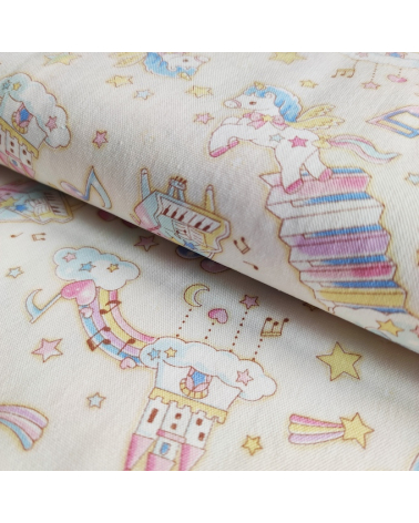 Tela japonesa Oxford fino "Unicornios musicales" con fondo vainilla.
