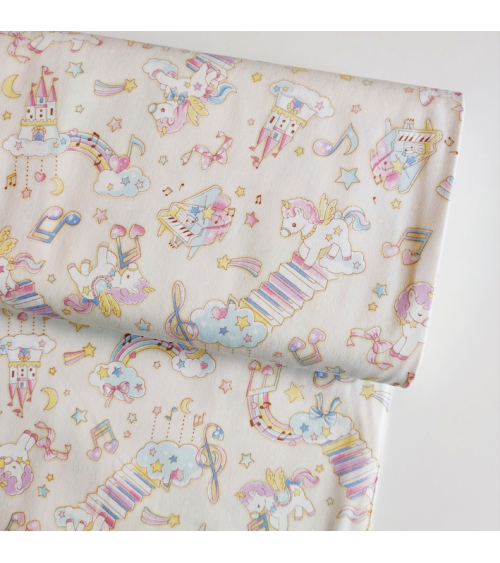 Tela japonesa Oxford fino "Unicornios musicales" con fondo vainilla.