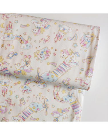 Tela japonesa Oxford fino "Unicornios musicales" con fondo vainilla.