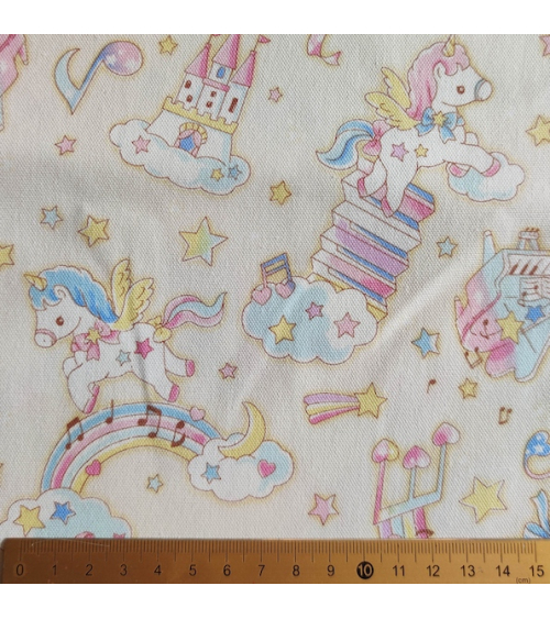 Tela japonesa Oxford fino "Unicornios musicales" con fondo vainilla.