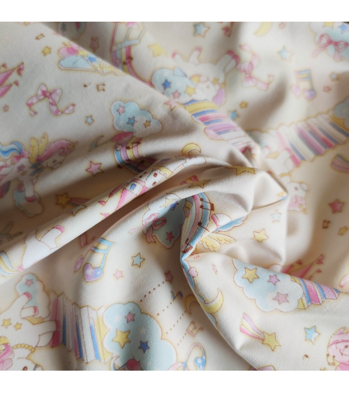 Tela japonesa Oxford fino "Unicornios musicales" con fondo vainilla.