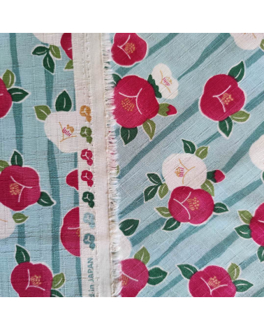 Tela de dobby japonés "Camelias" (Tsubaki) en azul claro.