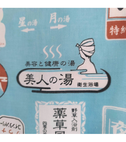 Tenugui (Japanese scarf) "Onsen" (32 cm x 90 cm) in light blue.