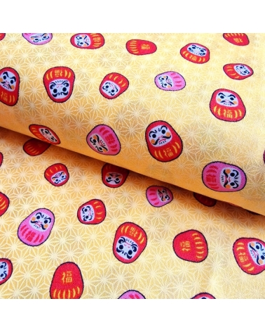 Japanese 100% cotton fabric "Darumas and asanoha" in yellow.