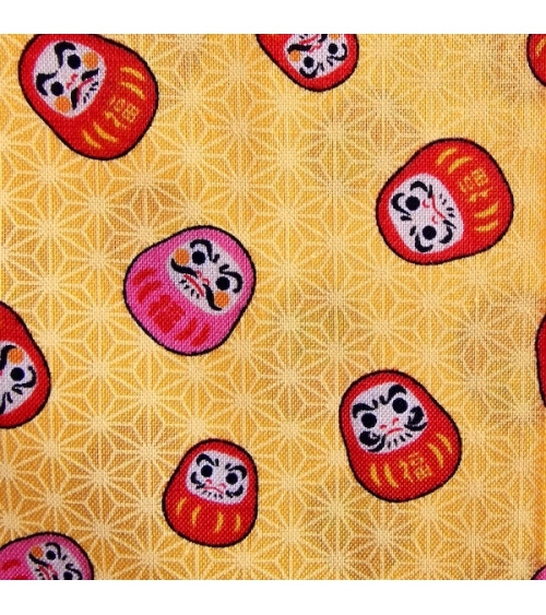 Japanese 100% cotton fabric "Darumas and asanoha" in yellow.