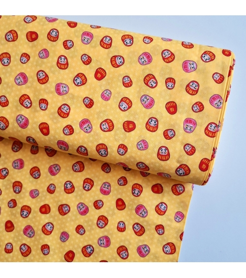 Japanese 100% cotton fabric "Darumas and asanoha" in yellow.
