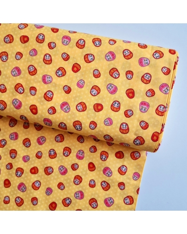 Japanese 100% cotton fabric "Darumas and asanoha" in yellow.