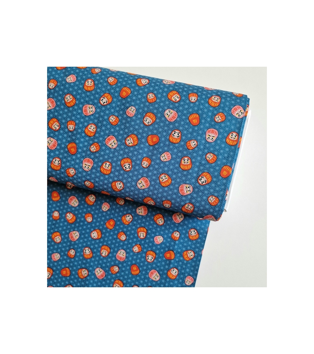 Japanese 100% cotton fabric "Darumas and asanoha" in blue.