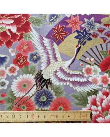 Japanese fabric. Multicolored cranes (tsuru) and flowers (hana) over lilac background, outlined in gold.