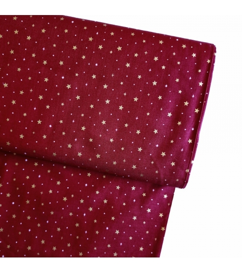 Tela japonesa de estrellitas doradas sobre fondo rojo guinda
