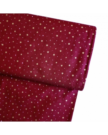 Tela japonesa de estrellitas doradas sobre fondo rojo guinda