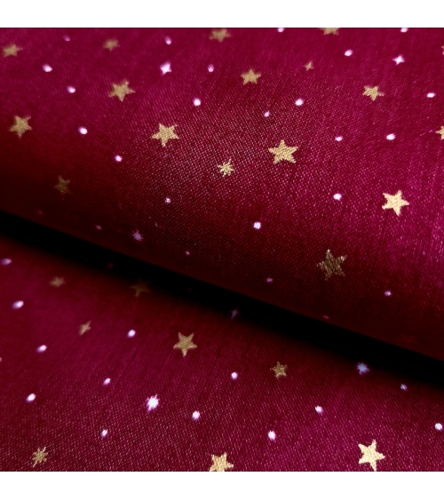 Tela japonesa de estrellitas doradas sobre fondo rojo guinda