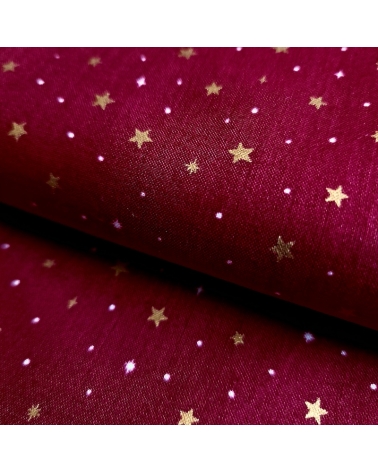 Tela japonesa de estrellitas doradas sobre fondo rojo guinda