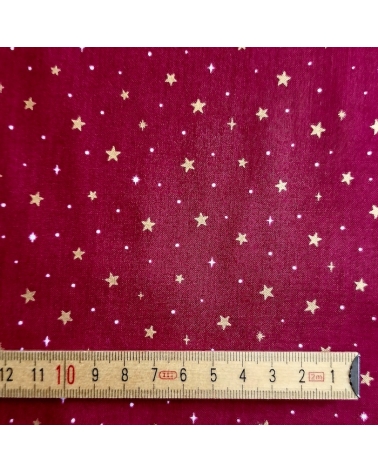 Tela japonesa de estrellitas doradas sobre fondo rojo guinda