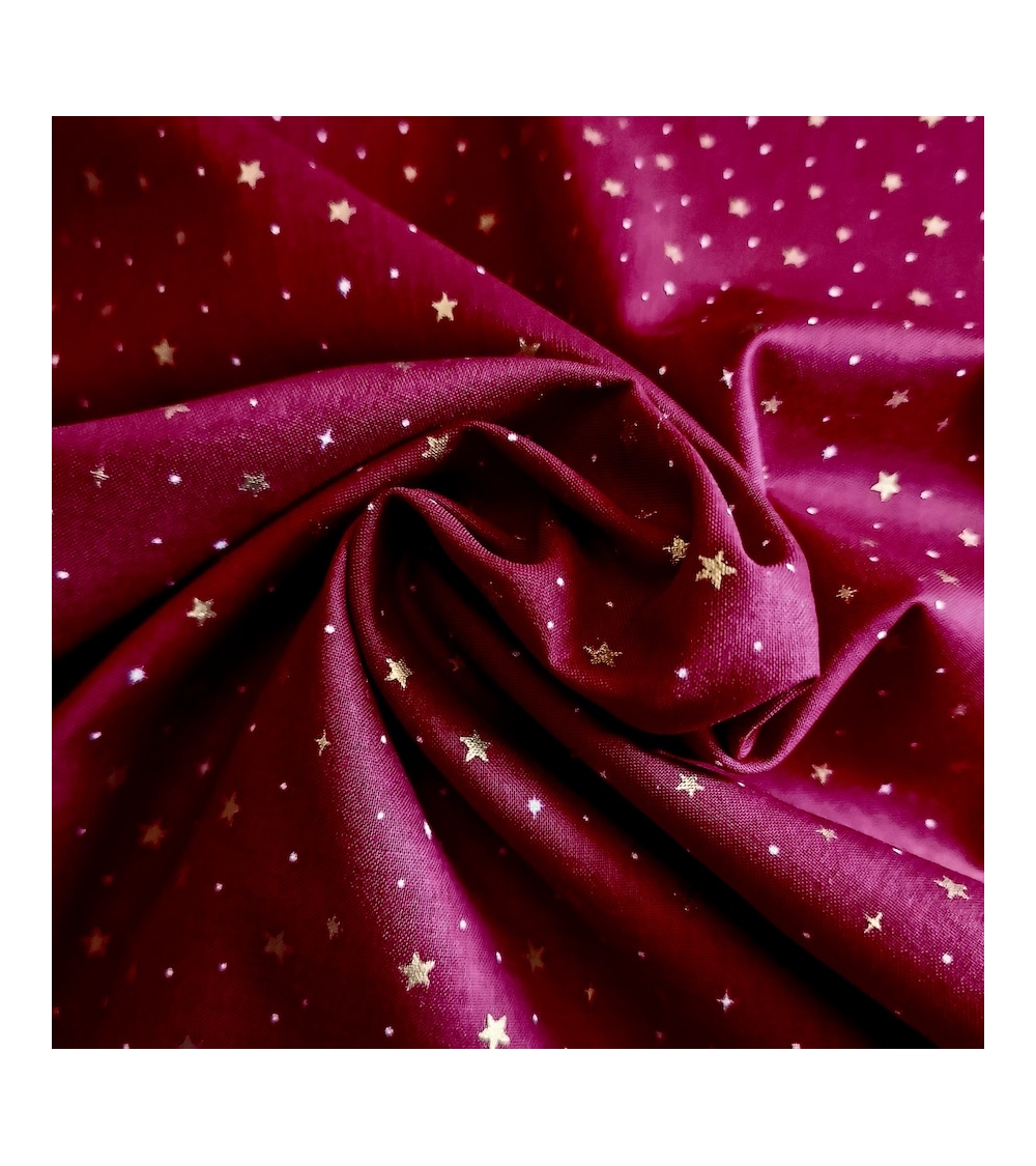 Japanese fabric with golden stars on a cherry red background
