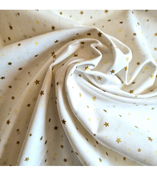 Tela japonesa de estrellitas doradas sobre fondo blanco