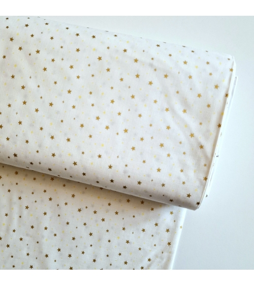 Tela japonesa de estrellitas doradas sobre fondo blanco